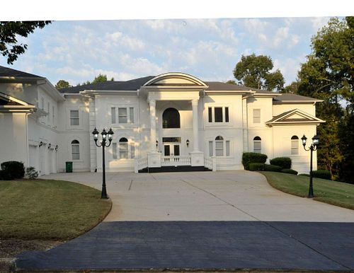 Elegant White Mansion Bathed in Golden Hour Light