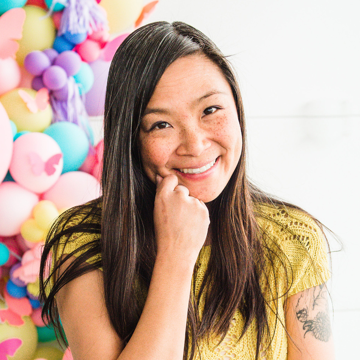 a smiling dog photographer in Calgary looking at the camera