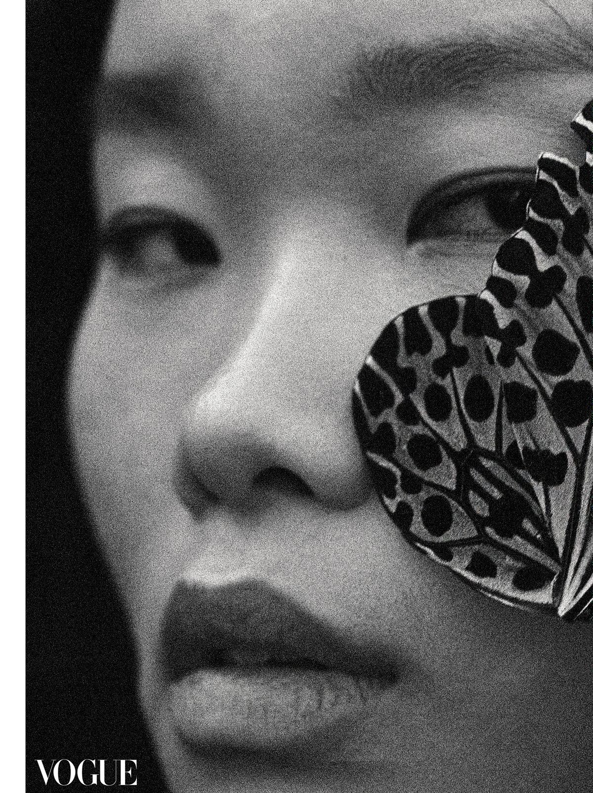 Beauty close up of a model with a butterfly on her cheek in a natural light. Photographed by Filianna Karamanli.