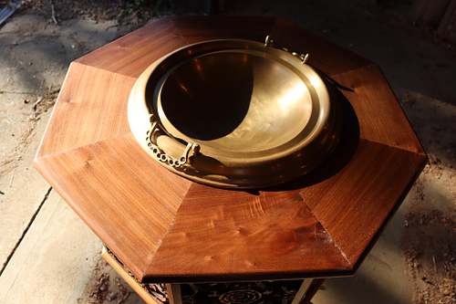 a detail showing the beautiful walnut figure on the top of the font.