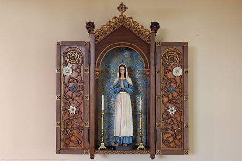 Restored Statue of St. Bernadette Soubirous in her custom shrine