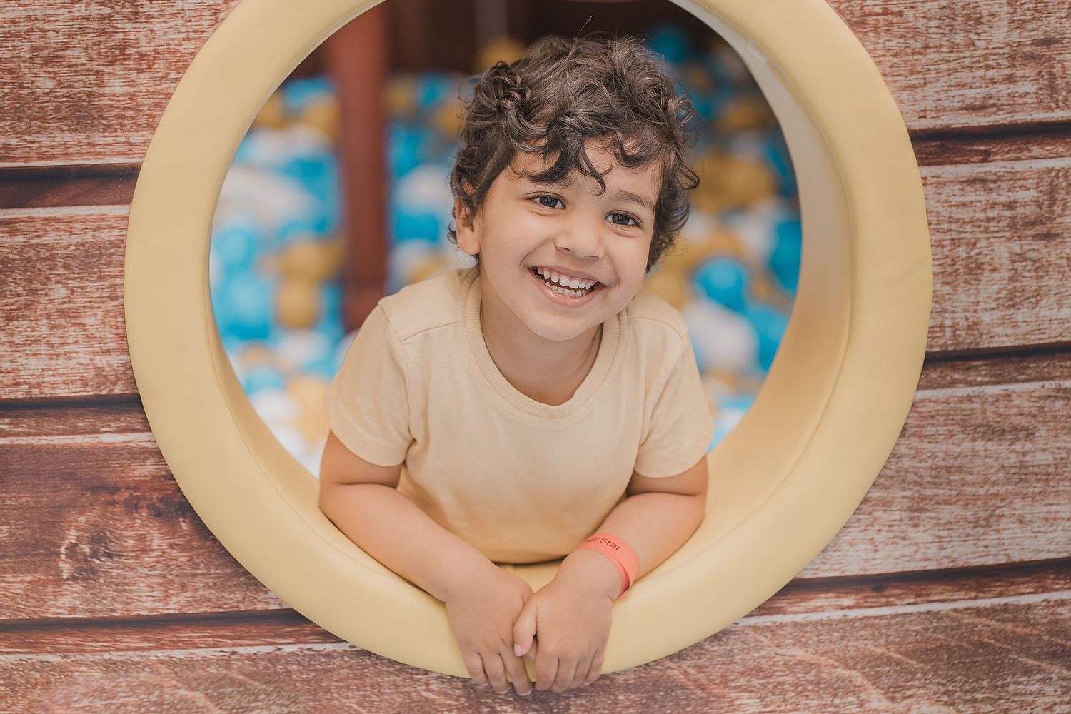 Kids photography session in Basel showing 2 year old happy boy with natural lighting