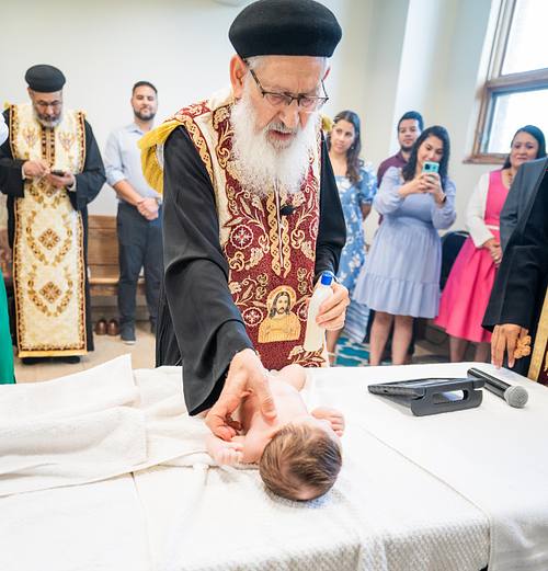 baby baptism ceremony at Ottawa church captured by Kameel Photography