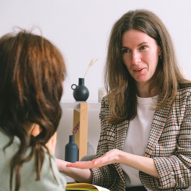 Woman meeting with healthcare provider in consultation about HRT