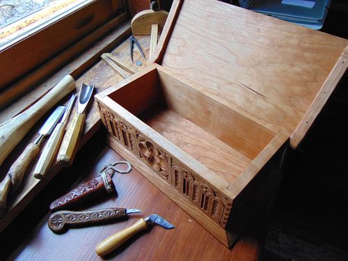 the hand carved cherry box with the lid open