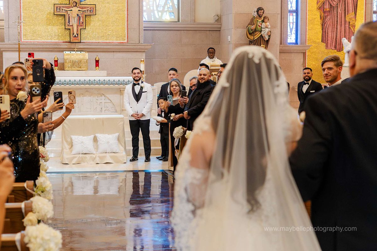 Exchanging vows at Saint Joseph, Husband of Mary Roman Catholic Church in Las Vegas Wedding Photography