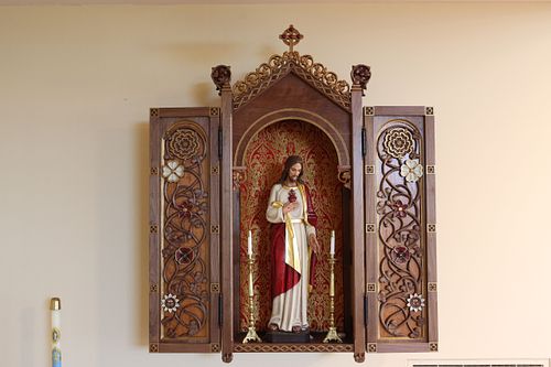 The beautiful new statue of Jesus in its custom shrine built and carved by hand by Wes Baker of Contrasts Woodcarving