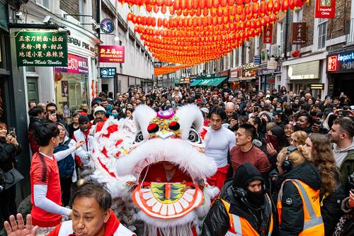 Dragon dangers during Lunar New Year celebrations in Chinatown, London, UK