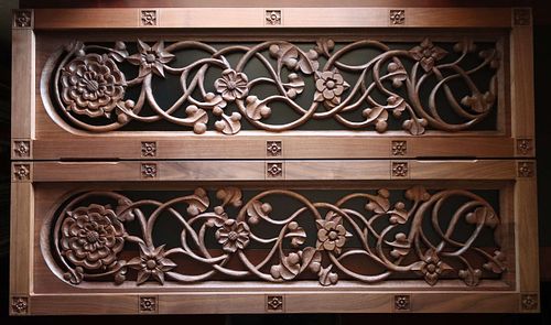 hand-carved walnut panels with vines and symbolic flowers for a shrine for the Blessed Virgin Mary