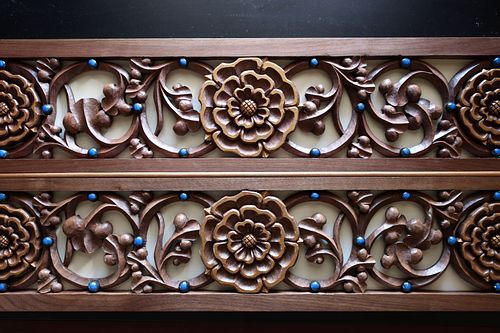 hand-carved rose and vine panel with liturgical white background