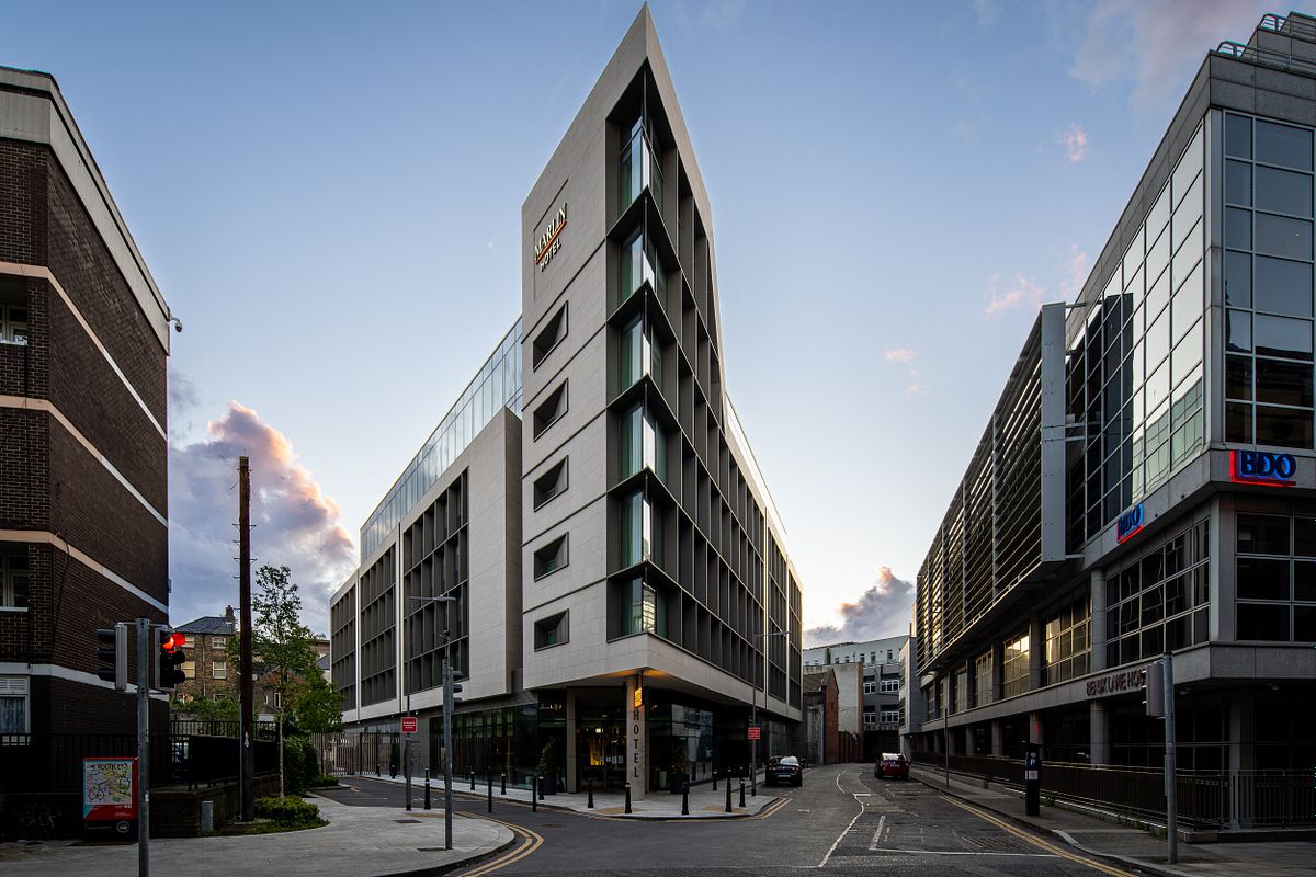 Exterior photograph of the Marlin Hotel Dublin, showing the full building, street, and adjacent buildings