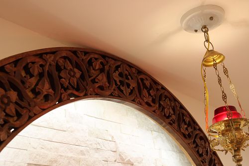 the cross, vines and flowers all carved by hand at the top of the arch over the tabernacle in the Dominican Sisters' Chapel in Columbus, Ohio