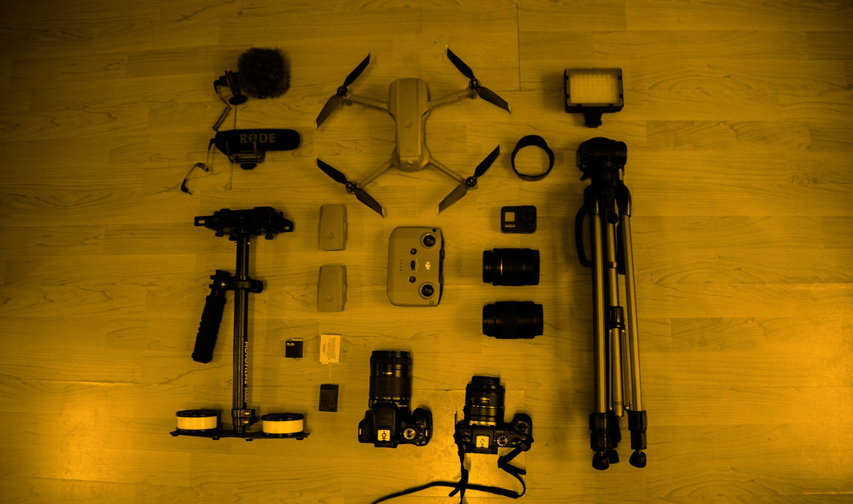 Camera equipments kept on a wooden table