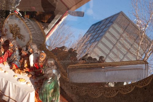 Last Supper iconography reflected in a store display, capturing the essence of small-town America