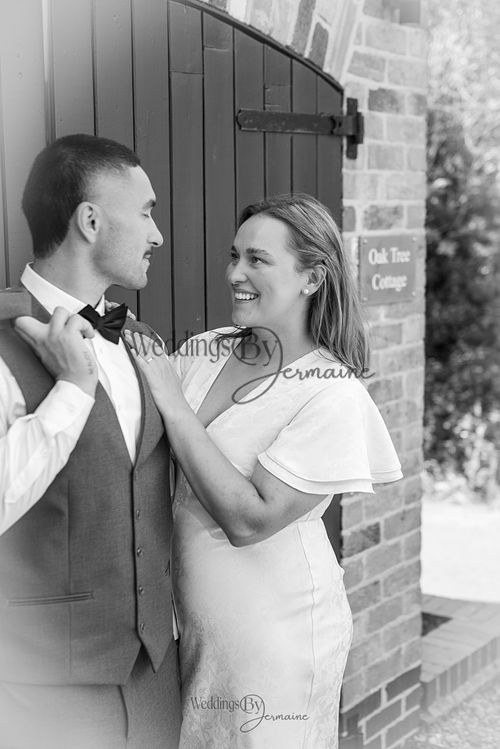 Bride-and-groom-listening-to-officiant-at-Oakham-Registry-Office