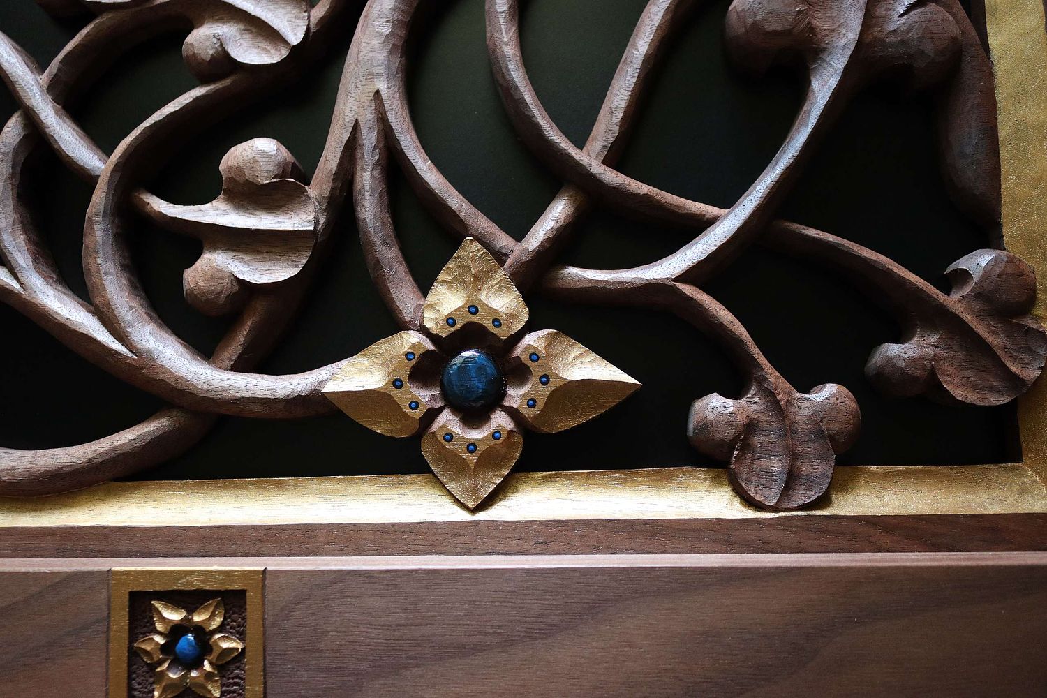 hand-carved Virgin's Bower Flower with gold and blue paint