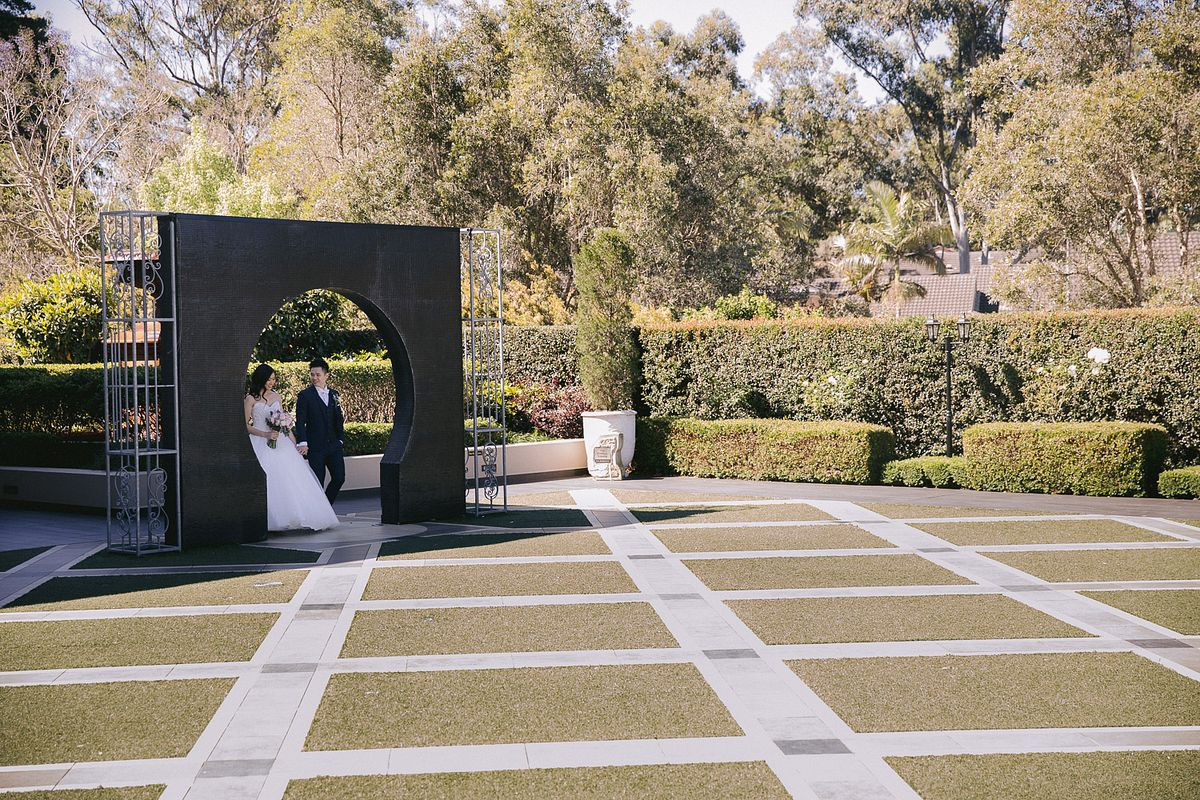 Bride and groom stepped into the keyhole arc at the Eternal Garden, Curzon Hall.