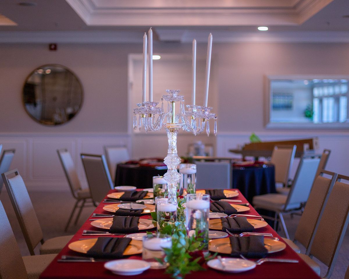 ball room table setting with candelabra in the center at the baywood ball room