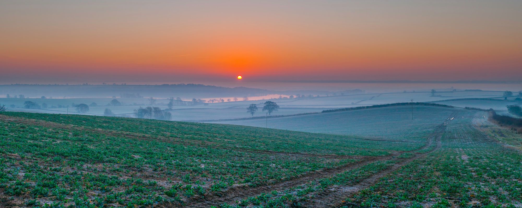 Eyebrook reservoir on a cold and foggy spring dawn.