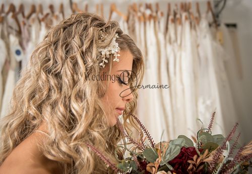 Model looking sideways to showcase bridal hair and makeup, with elegant hair accessories from Sydney Grace Bridal, photographed by Weddings by Jermaine, featuring flawless work by Justaboutweddingshair and beauty