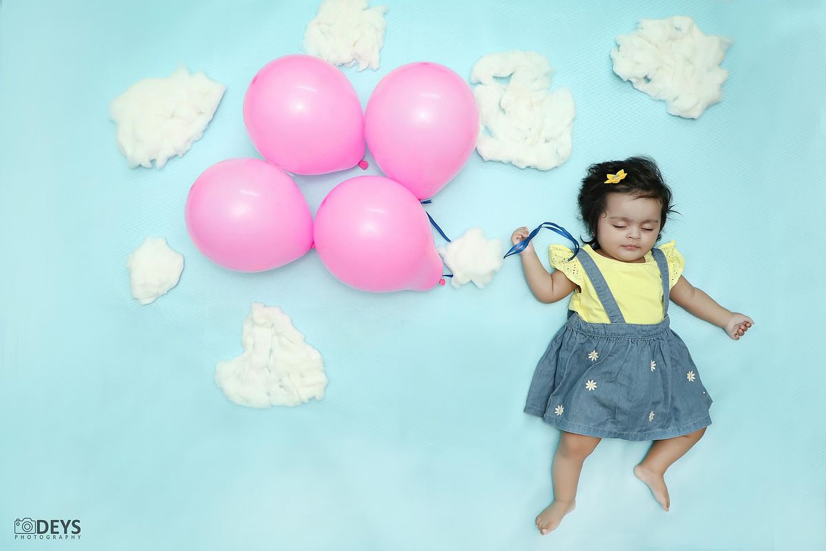 Unique baby photography with sky theme