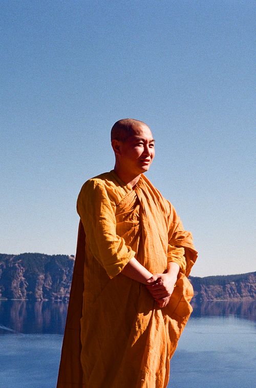 Monk posing at Crater Lake Oregon