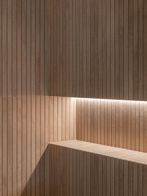 Soft lighting accentuating geometric forms and natural textures &ndash; Columna project