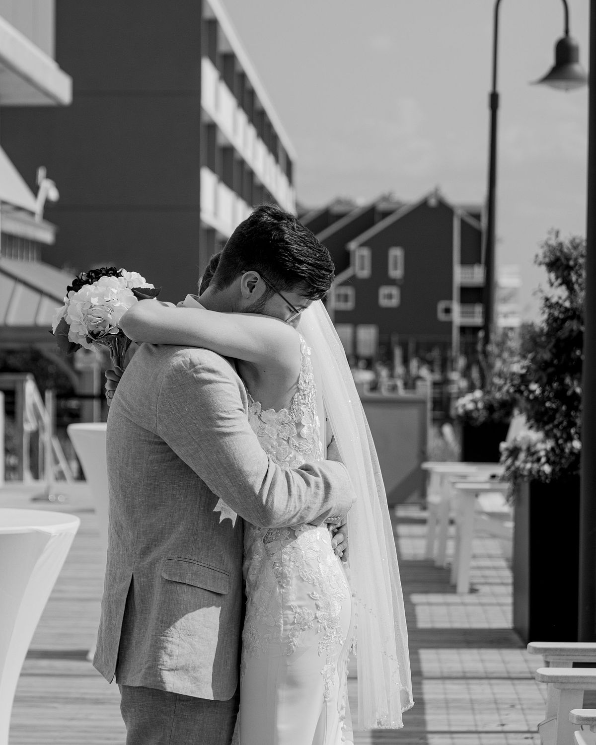 bride and groom  hugging after ceremony in dewey beach, delaware