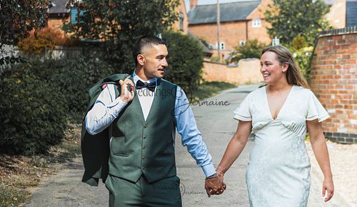 Bride-and-groom-listening-to-officiant-at-Oakham-Registry-Office
