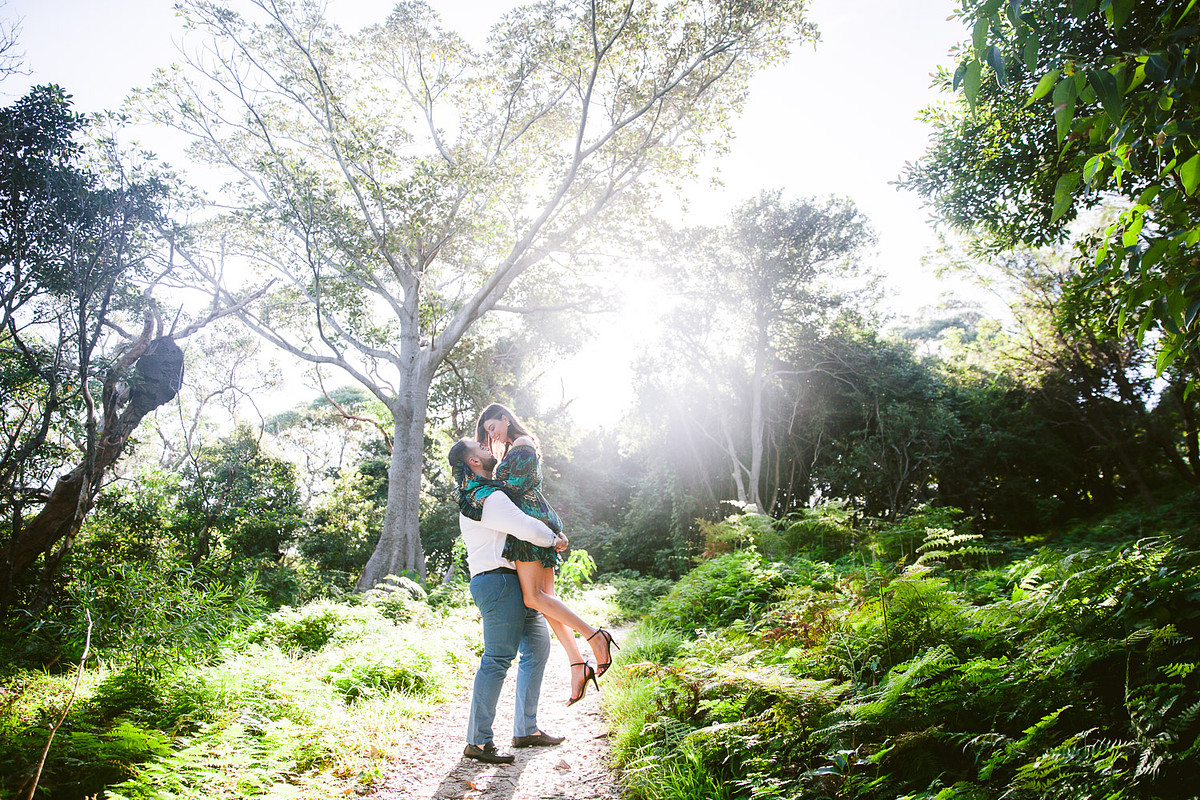 Engagement photography capturing a couple sharing a joyful moment together at the National Park adjacent to Gunners Barracks