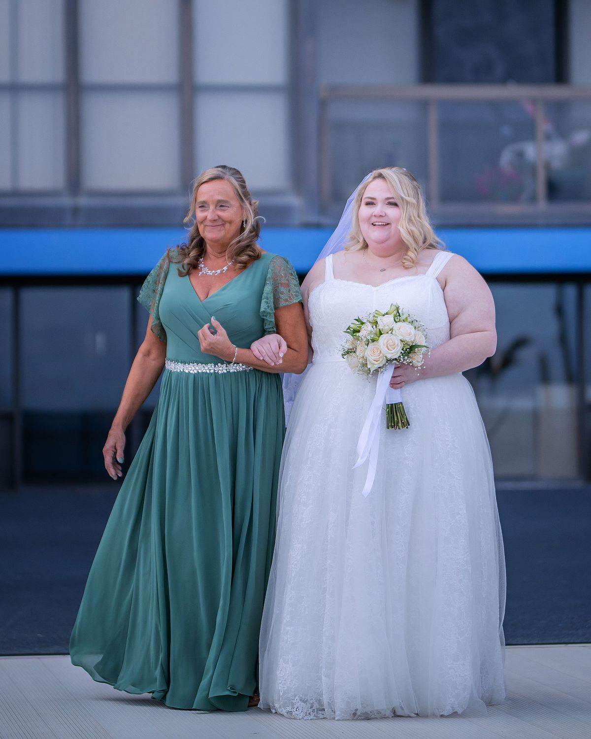 Beach wedding ceremony at Golden Sands Ocean City MD, with bride and mother-of-the-bride walking down the aisle