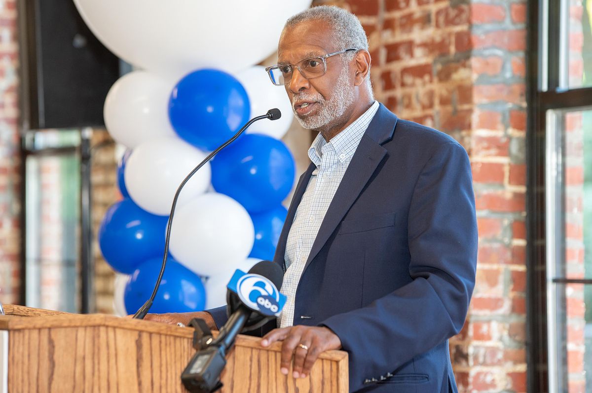 Pennsylvania State Senator Art Haywood speaking at a Philadelphia press conference podium during a civic leadership event.