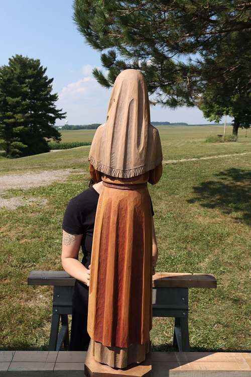 The back of antique St Bernadette statue showing original paint