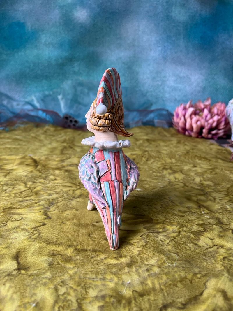Harlequine Bird. Tiny sculpture