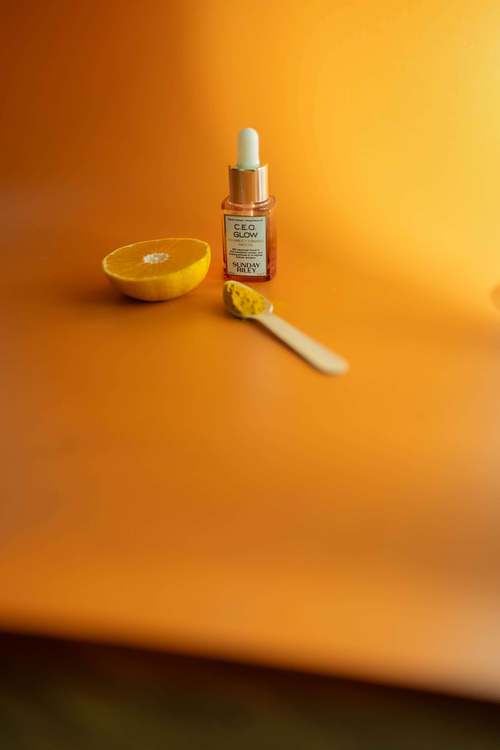 Small bottled product placed on a bright yellow background