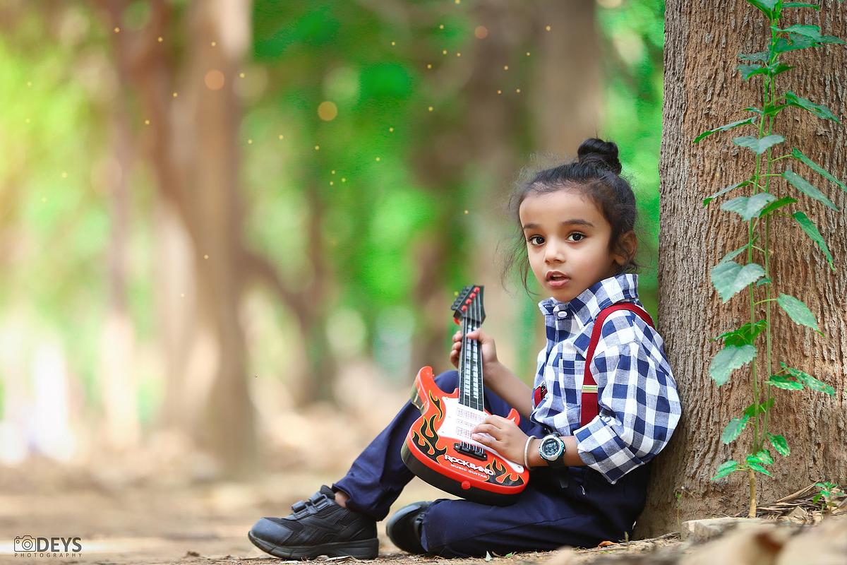 Kids shoot with guitar