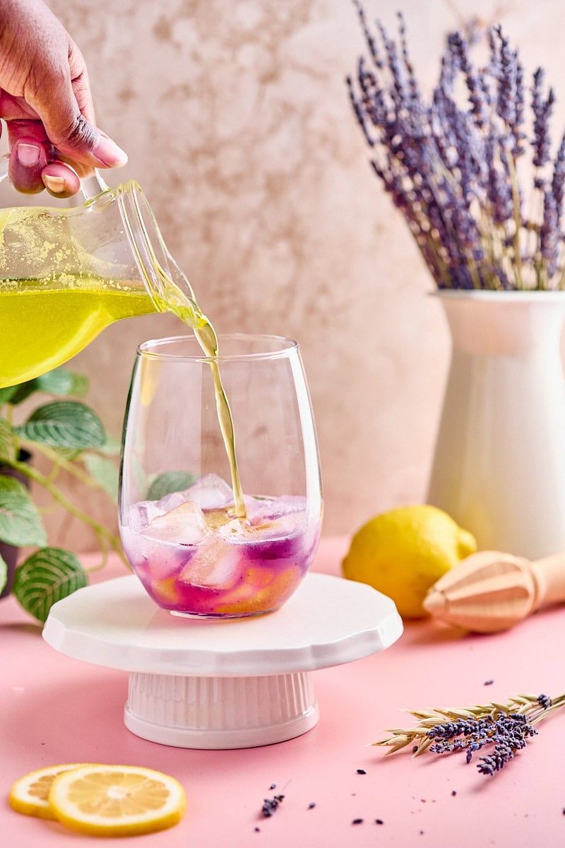Pouring lemonade syrup to create a lavender lemonade