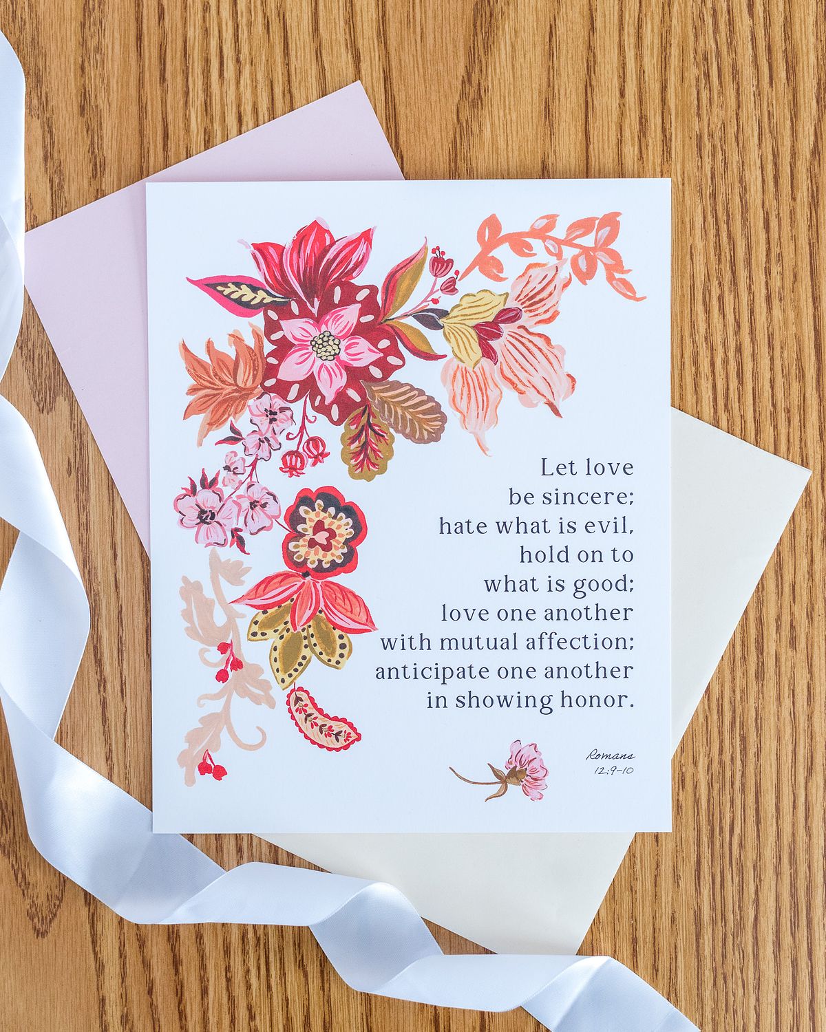 catholic handmade flower artwork and Romans scripture verse with ribbon taken by cranberry township, pa newborn photographer
