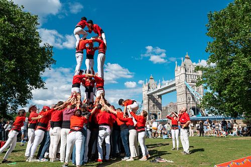 Castellers of London build a human tower, Tower Bridge, London, UK