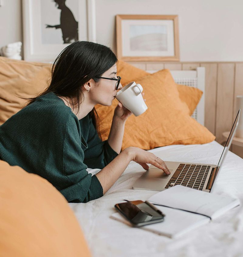 Perimenopausal woman watching educational video about menopause on device