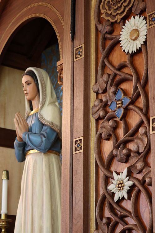 Total statue restoration and new custom, hand-carved shrine for a statue of St. Bernadette Soubirous by Wes and Kelly Baker in walnut, cherry, polychrome paint, and gold leaf