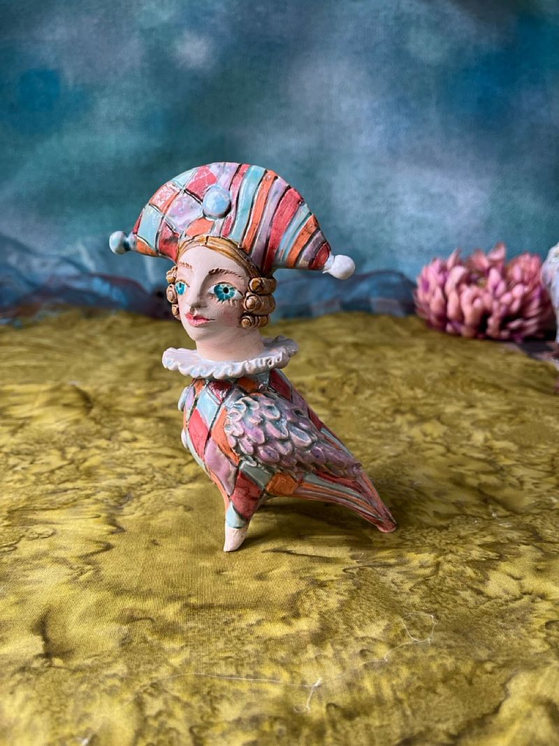 Harlequine Bird. Tiny sculpture
