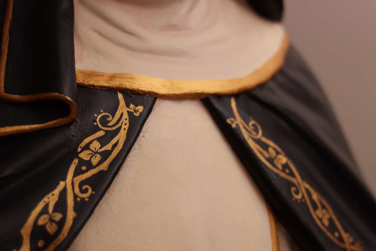 Detail showing the rose vines painted by hand onto the restored St. Rose statue