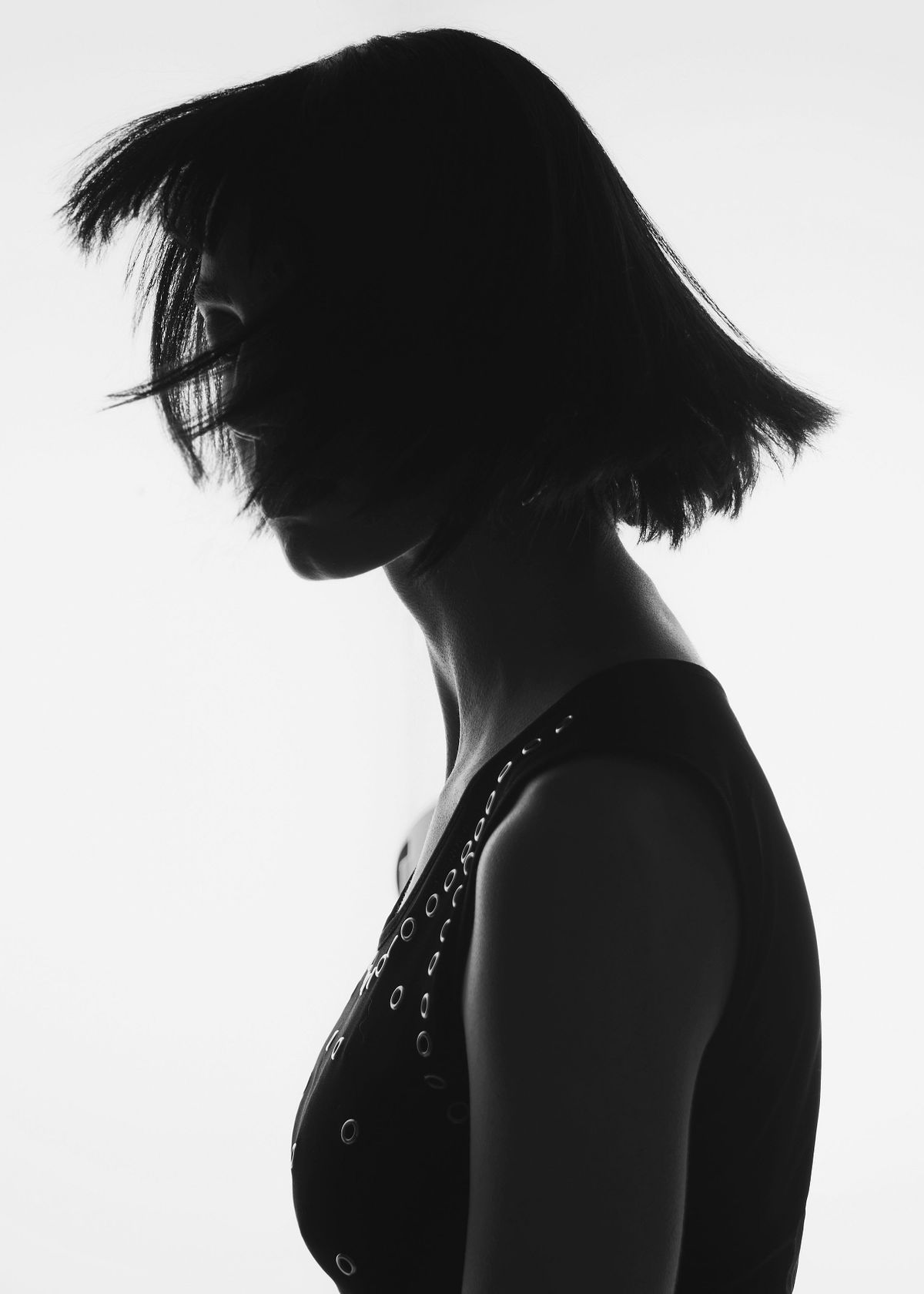Black and white photography with backlight studio light featuring a female model. Photographed by Filianna Karamanli.