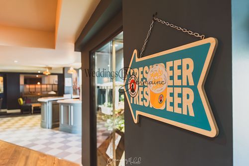 Sign directing guests to the bar at Sketchley Grange Hotel and Spa, captured by Weddings by Jermaine, showcasing the venue’s thoughtful signage and elegant design