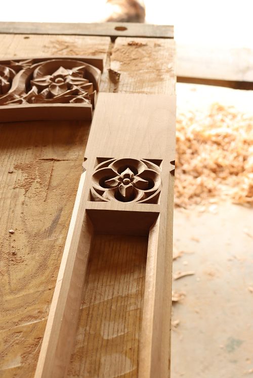 carving of quatrefoil with virgin's bower flower in the center at the bottom of a column for the Dominican Sisters' Chapel
