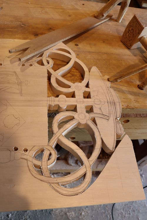 cutting out coat of arm process photo