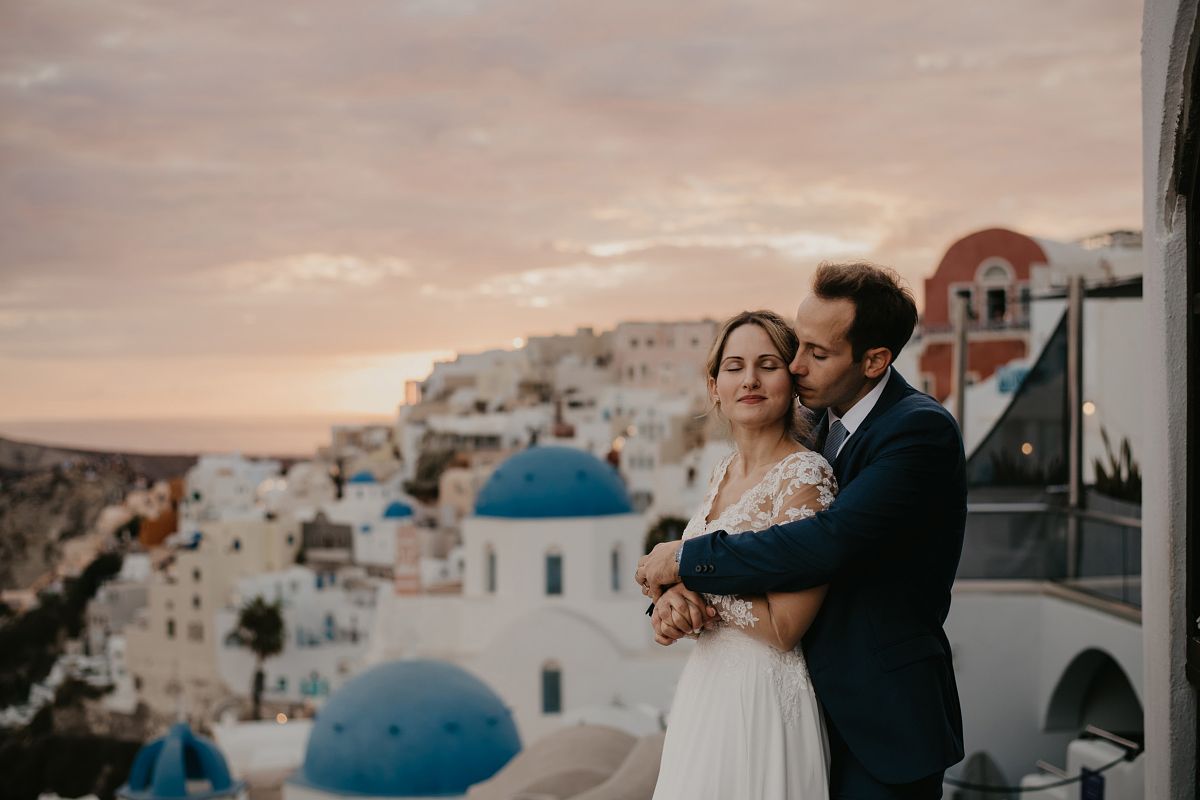 luxury wedding in Santorini Greece with caldera view at sunset &ndash; destination wedding photographer