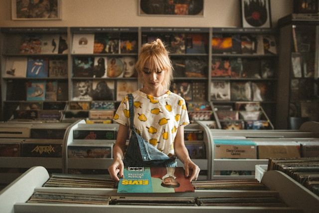 person holding a vinyl sleeve