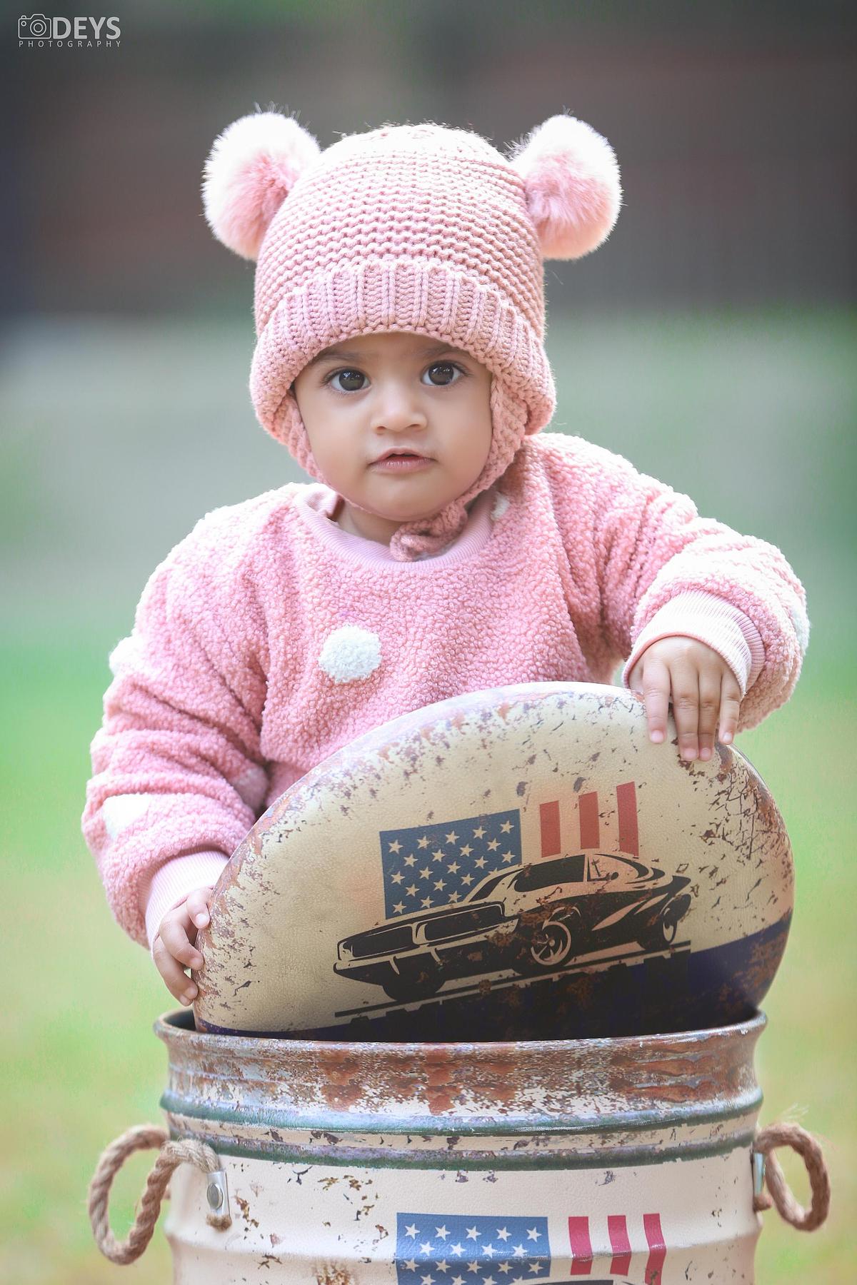 Adorable prebirthday baby photoshoot outdoor